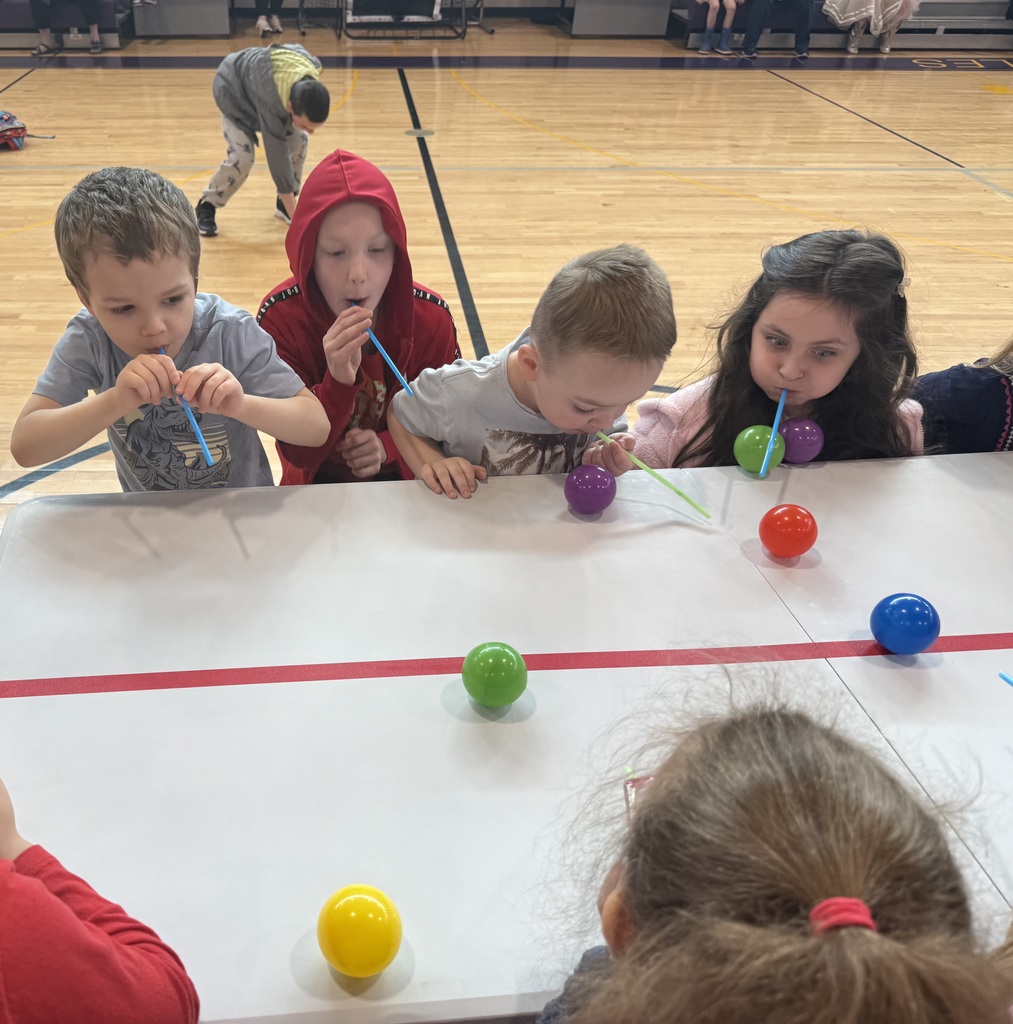 students doing games at an assembly
