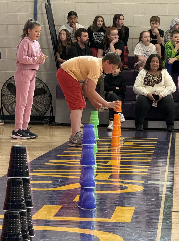 students doing games at an assembly