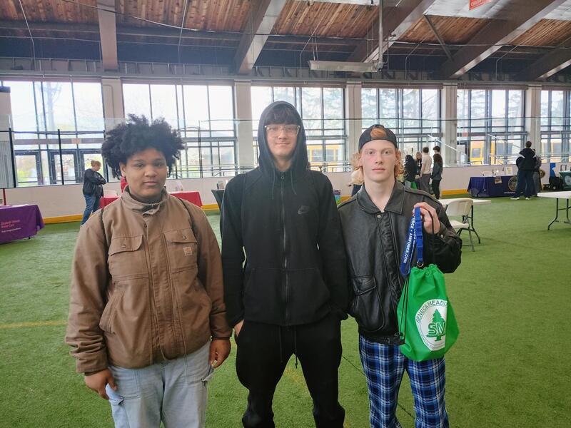 three students at a career fair