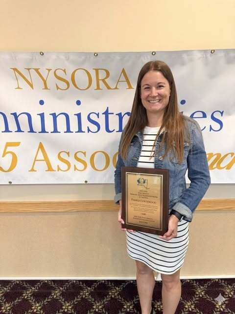 woman holding award