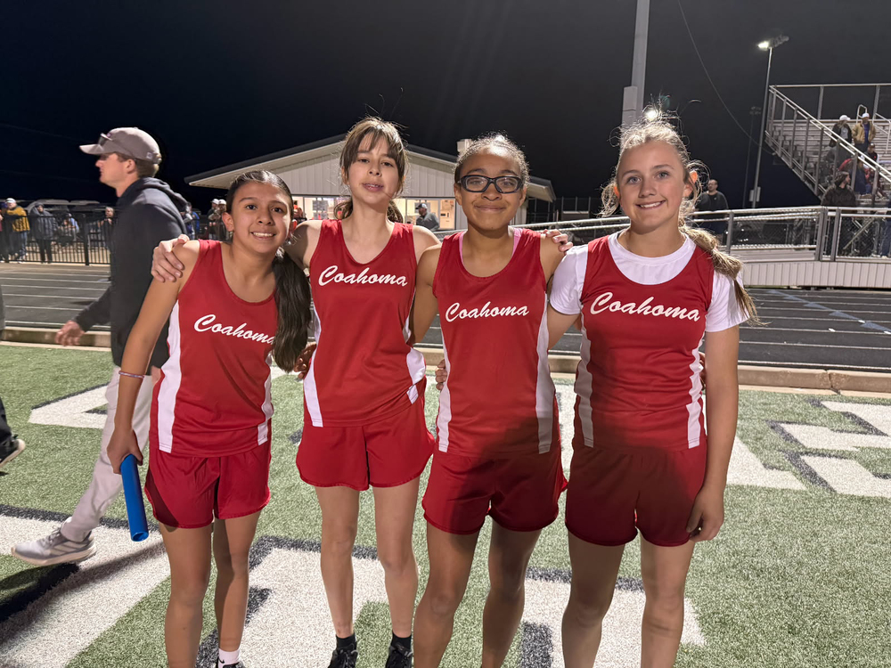 track members posing for a photo after a meet
