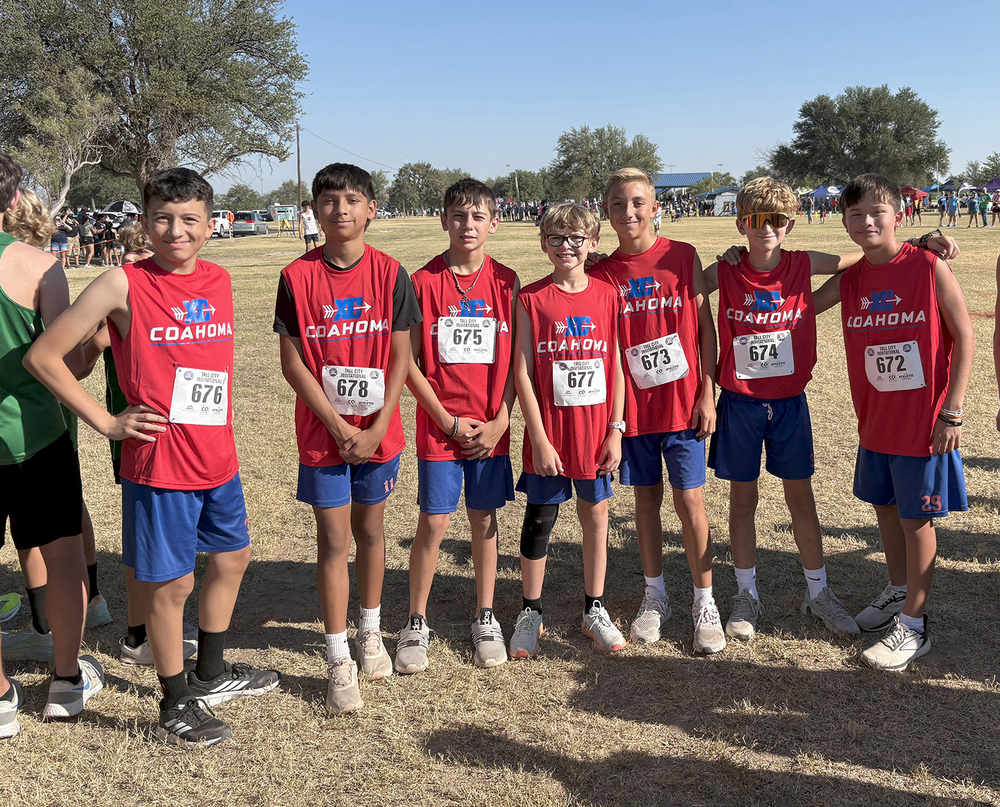 Cross Country boys team posing for a photo
