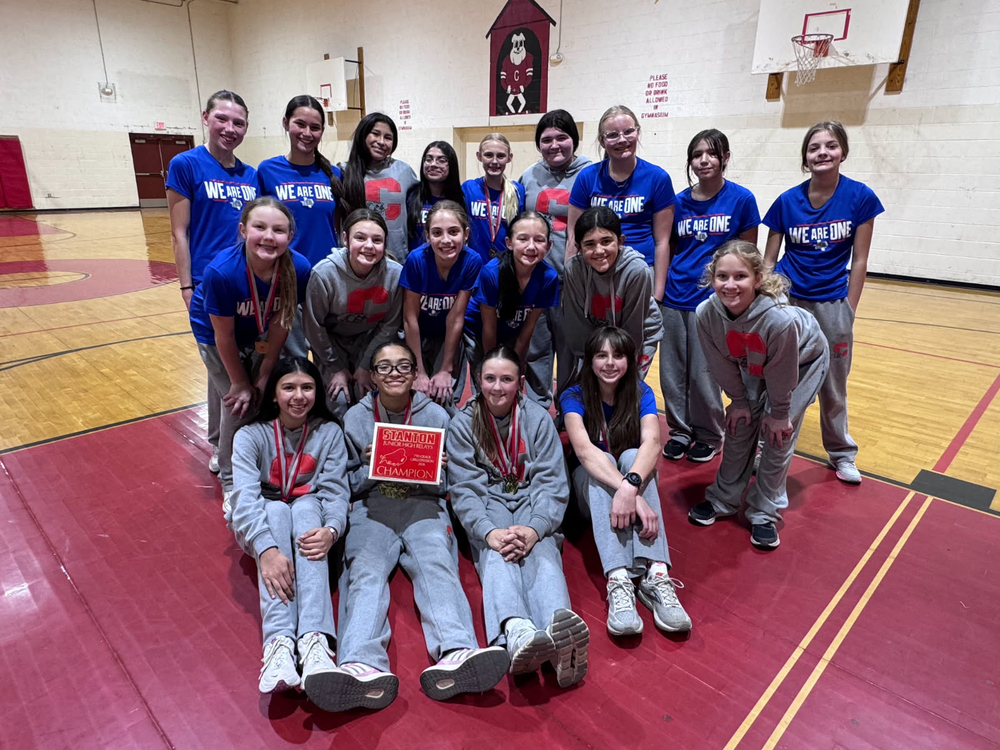 7th Grade Track team with 1st place plaque