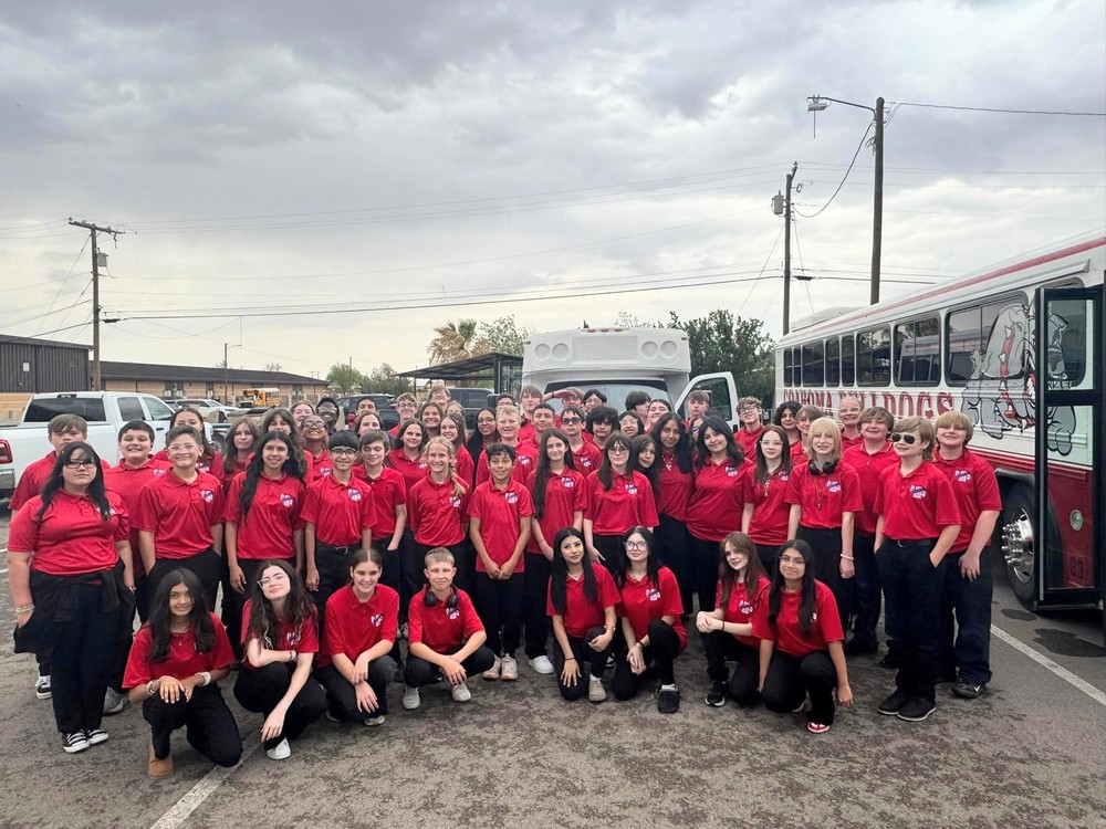 Junior high band students posing for a photo after they performed at UIL concert contest