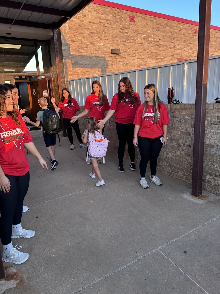 young adults welcoming students to school