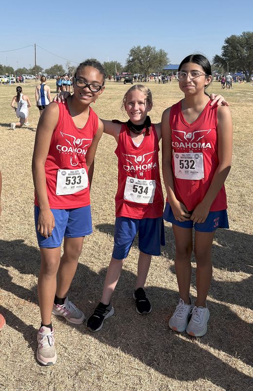 Cross Country girls team posing for a photo