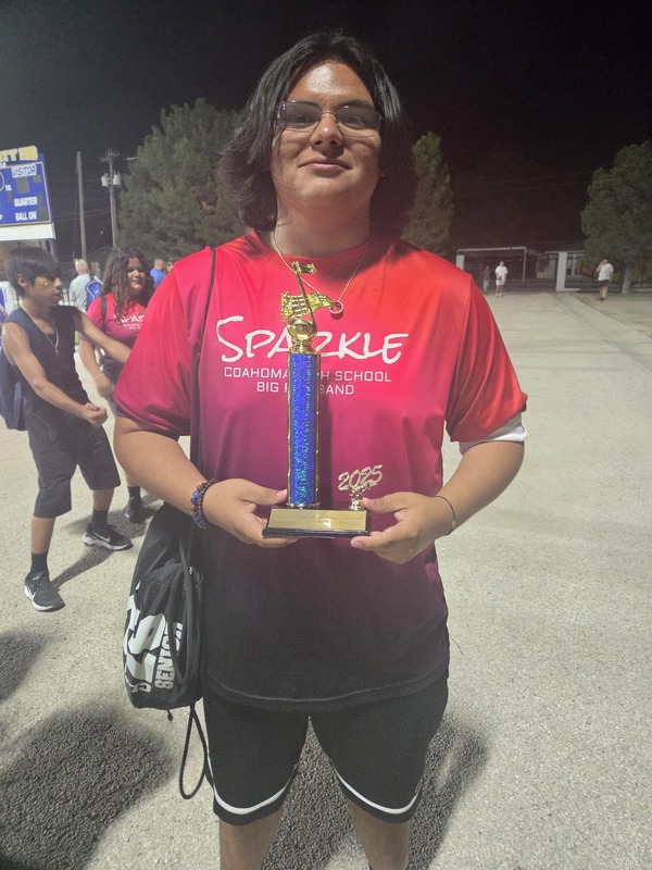 Band student holding a trophy
