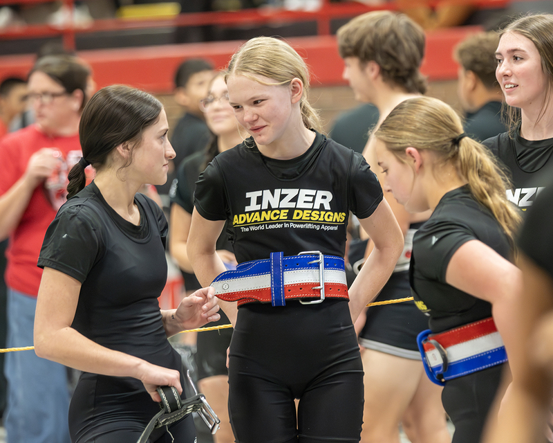 Youths visiting during a competitive powerlifting meet