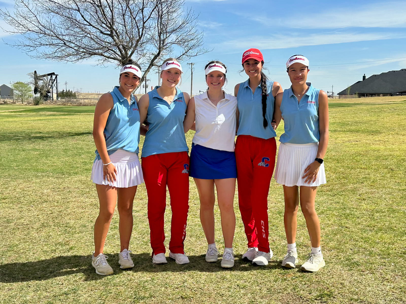 High School golf players pose for a photo after a meet