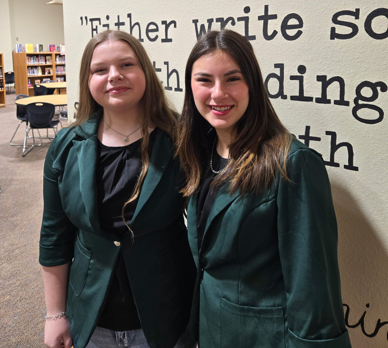 Two CHS debate partners pose for a photo before UIL district contest