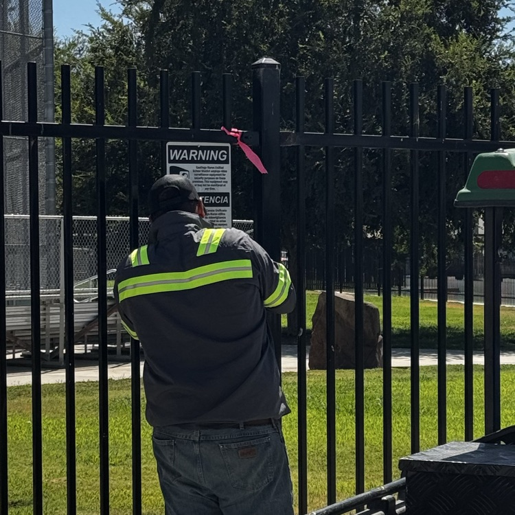 Maintenance puts up signs around the district