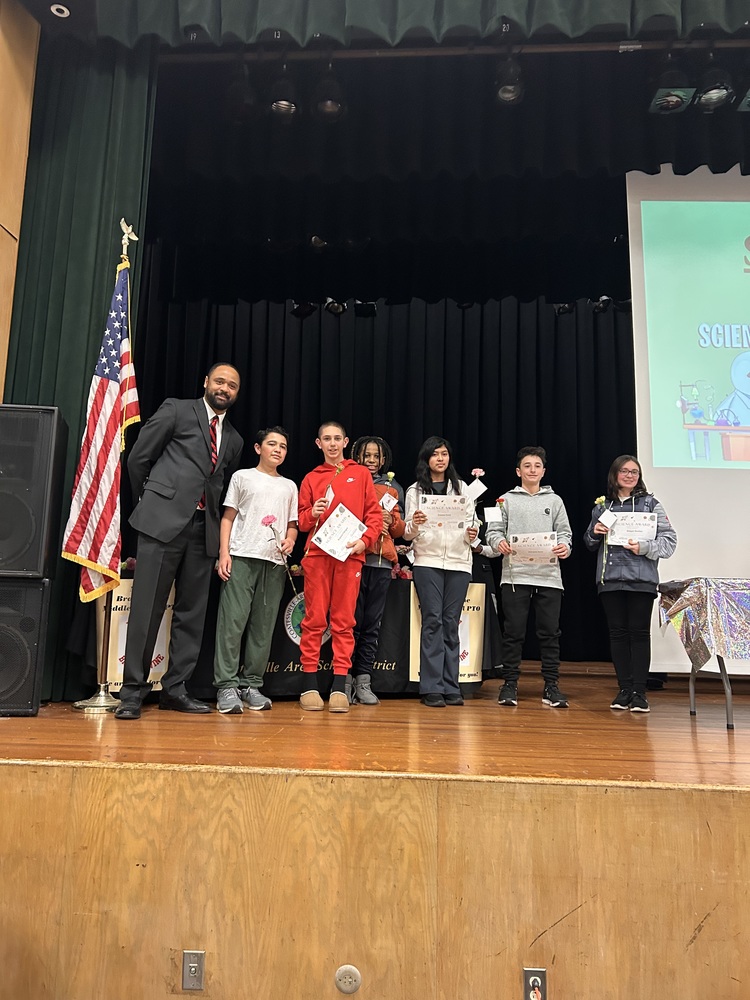 students on stage receive award