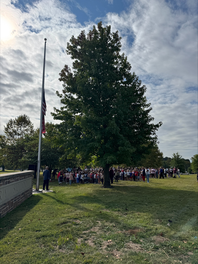 Students gather by the flagpole for a Patriot's Day Assembly led by Mr. Kuciapinski and members of local fire and police departments.