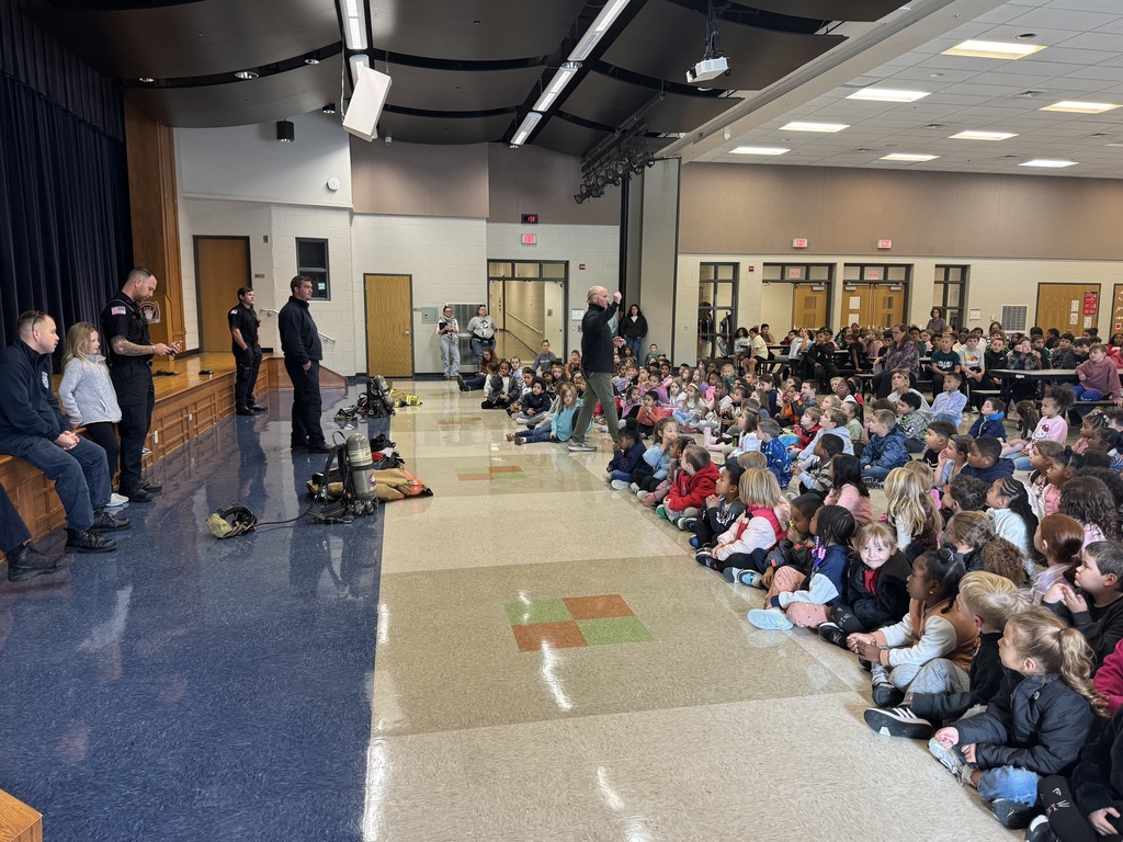 Rainbow students are visited by local firefighters to learn about fire safety.