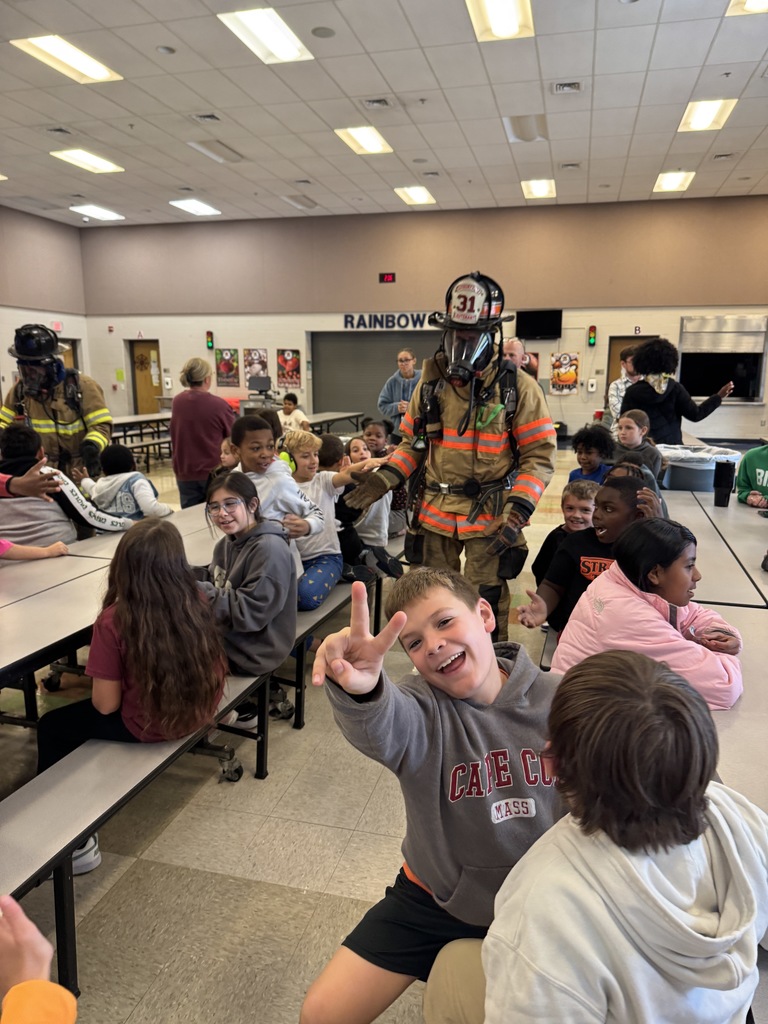 Rainbow students are visited by local firefighters to learn about fire safety.