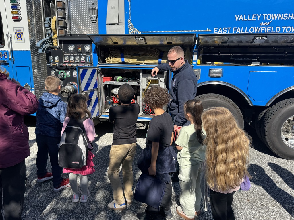 Rainbow students are visited by local firefighters to learn about fire safety.