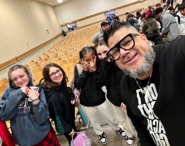 Carlos Ojeda Jr. and students at North Brandywine Middle School