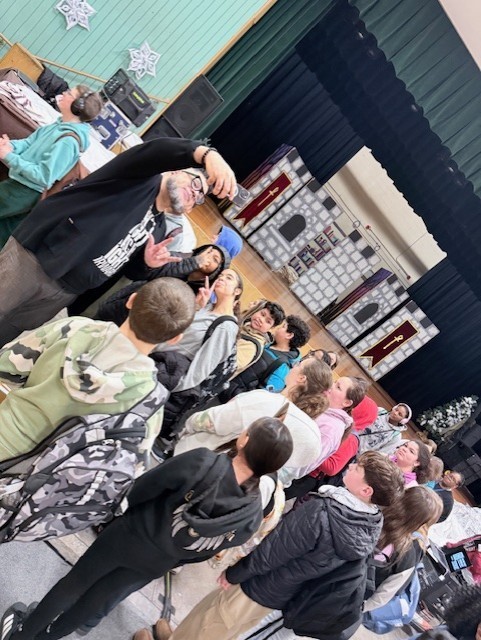 A second picture of Carlos Ojeda Jr. with students from North Brandywine Middle School