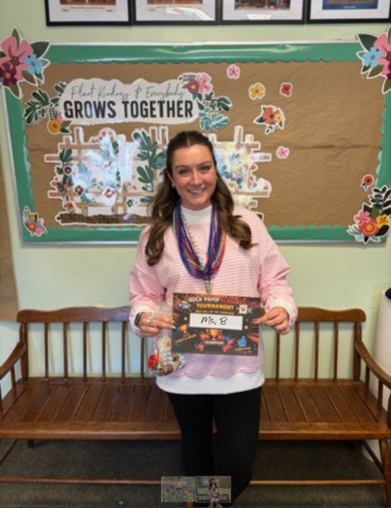 Ms. B, the winner of the Rocks, Paper, Scissors March Madness Competition