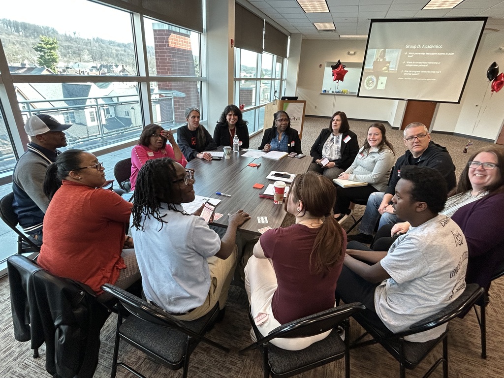 Breakout group #2 meets to gather ideas and plan.