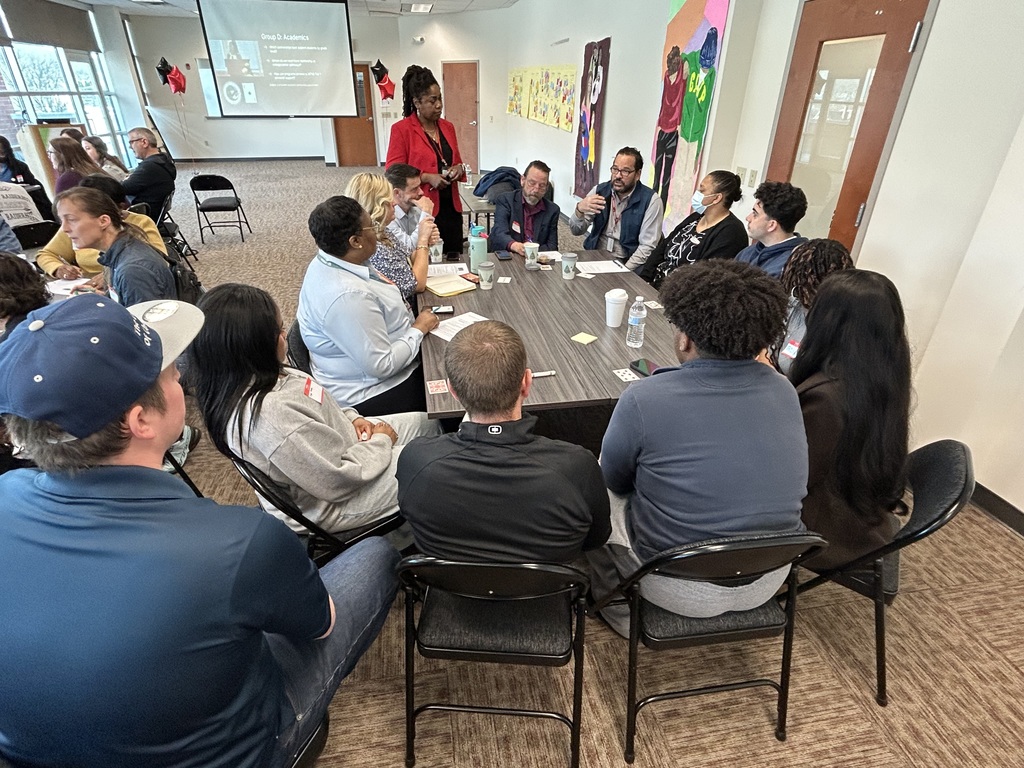 Breakout group #1 meets to gather ideas and plan.