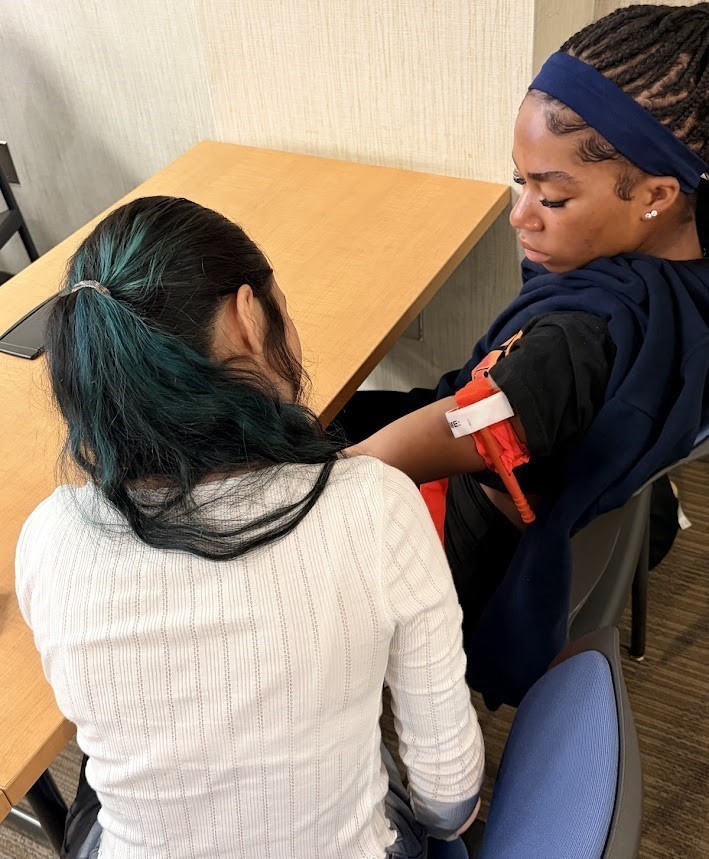 Students learning to treat patients.