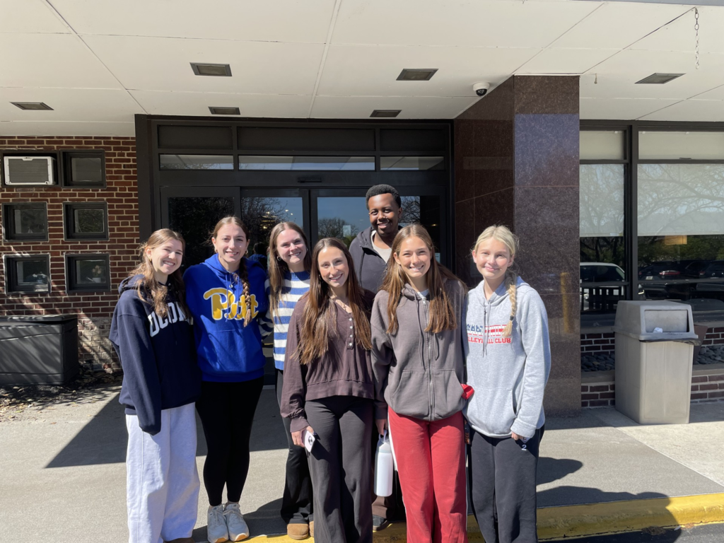 Picture of CASH Interact Club seniors in front of the Harrison House.