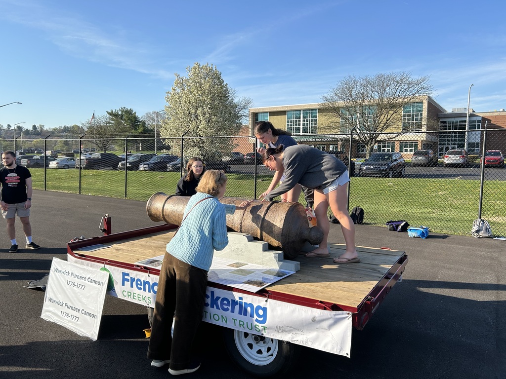 Students getting the opportunity to examine the Warwick Furnace Cannon.