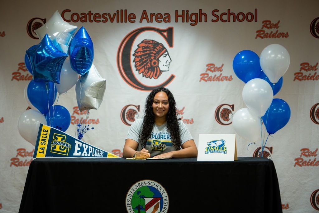 Picture of Kylee Bostic signing.