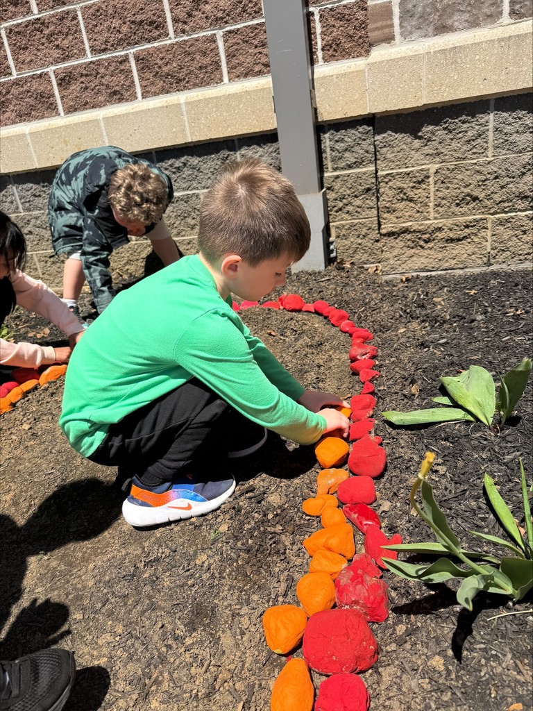 Rainbow Garden Club student painting rocks #2.