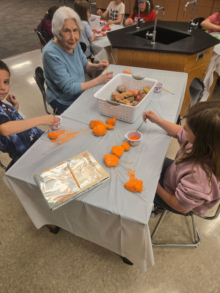 Rainbow Garden Club student painting rocks #3.