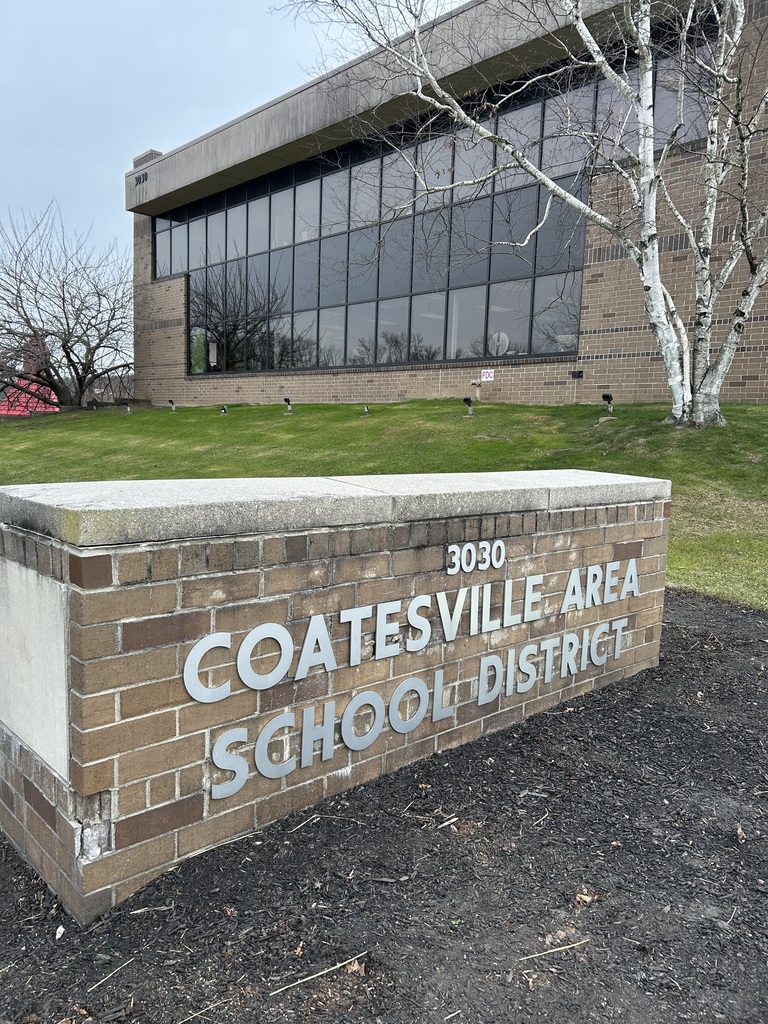 Picture of the administration building with the Coatesville Area School District sign out front.