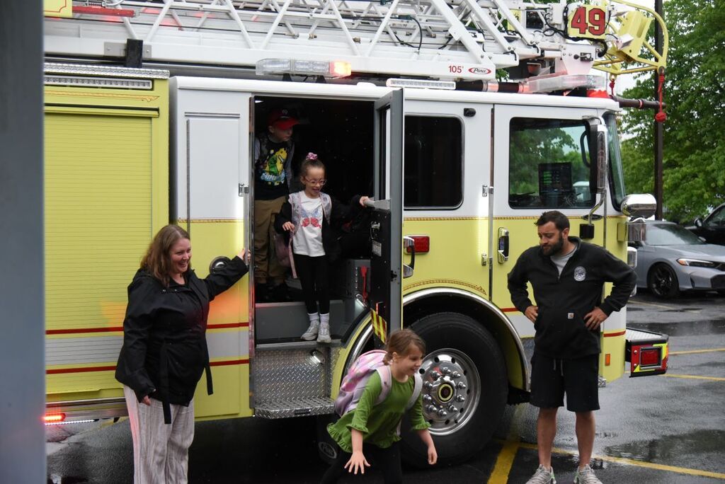 Students getting off of the fire truck at Reeceville Elementary #1