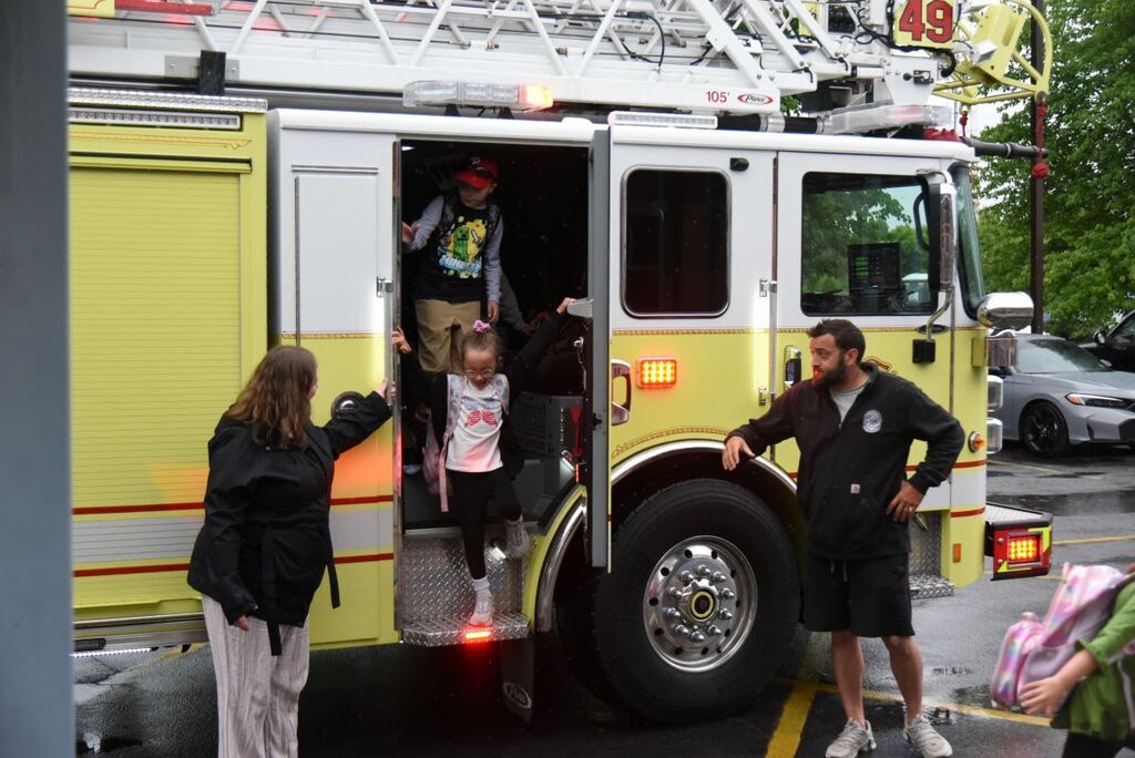Students getting off of the fire truck at Reeceville Elementary #2