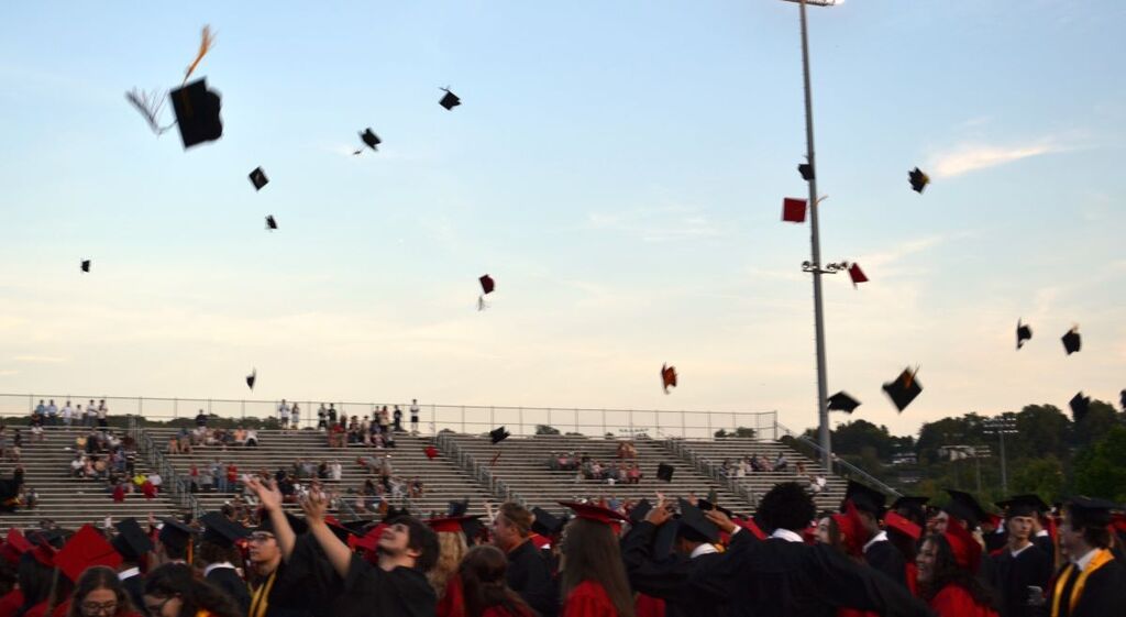Caps in the air!