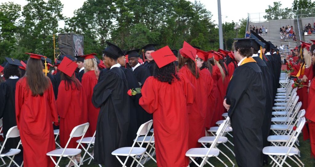 Graduates awaiting the ceremonies to end.