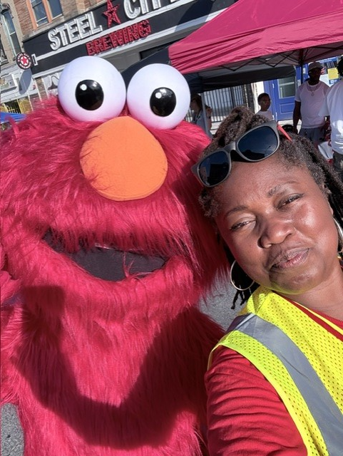Dawn Mader and Elmo showing out.