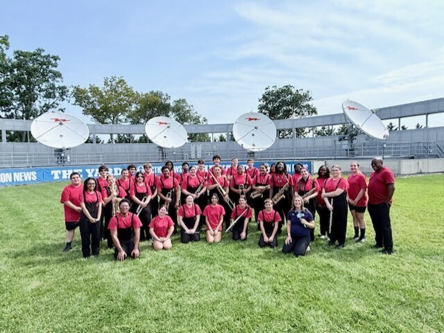 Red Raider Marching Band posing for a picture "On the Yard" at 6ABC.