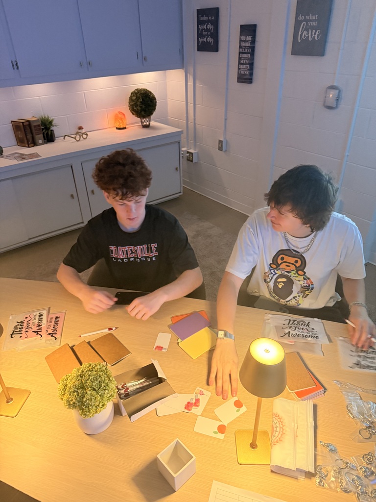 Brandon and Declan prepare bravery kits.