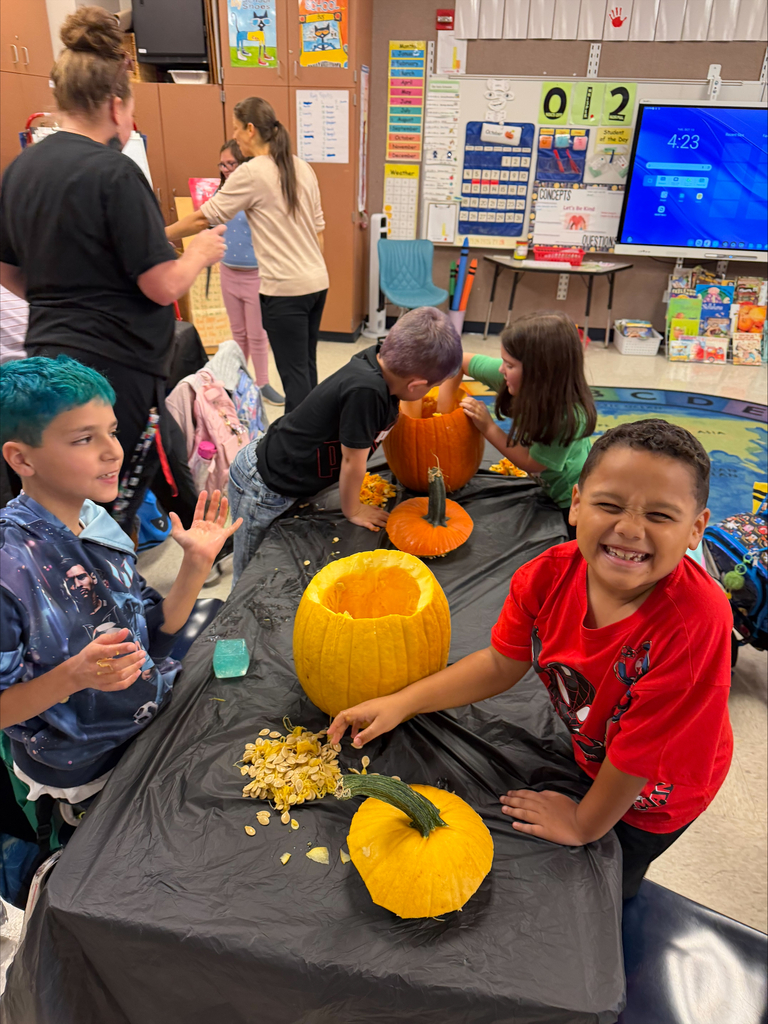 Rainbow Elementary Gardening Club October 2026 meeting making pumpkins into planters for fall mums pic#3