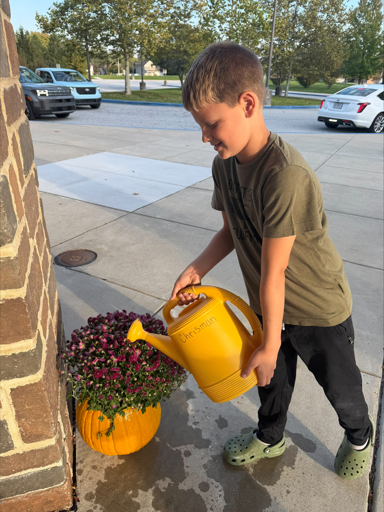Rainbow Elementary Gardening Club October 2026 meeting making pumpkins into planters for fall mums pic#7