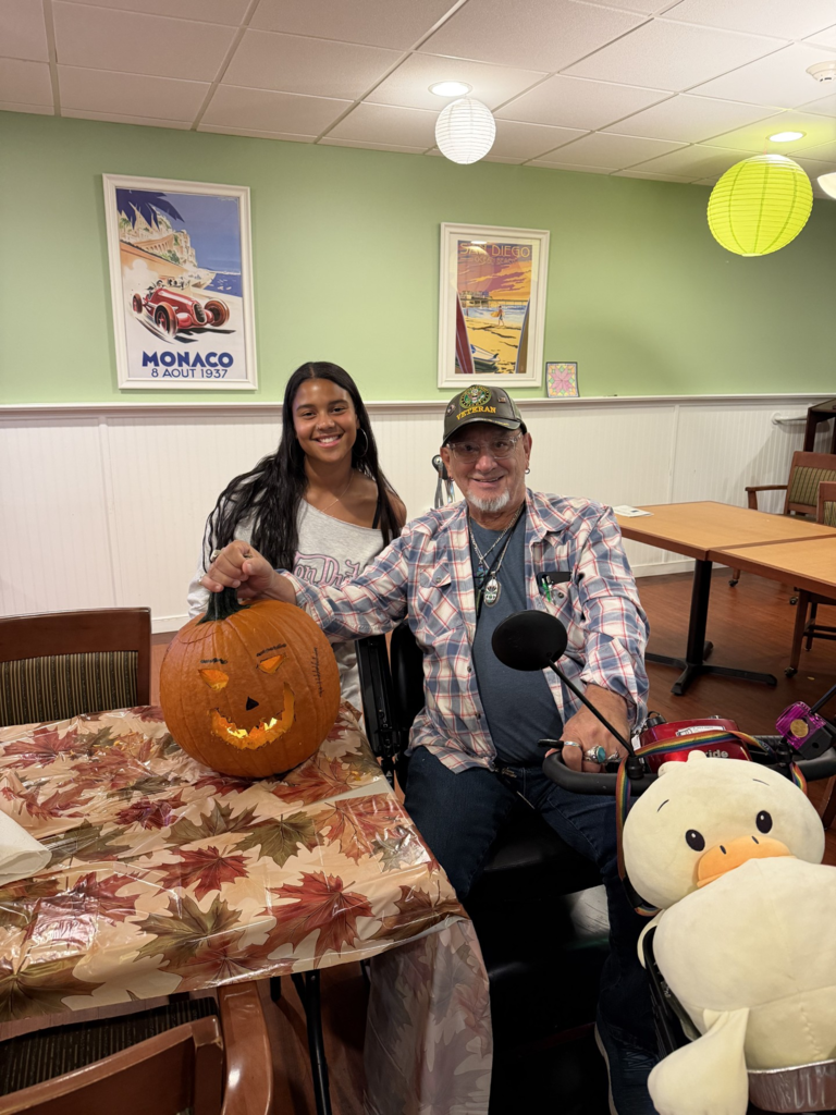 CASH Interact Club visits Harrison House on Wednesday, October 21, to visit residents and carve pumpkins pic#1
