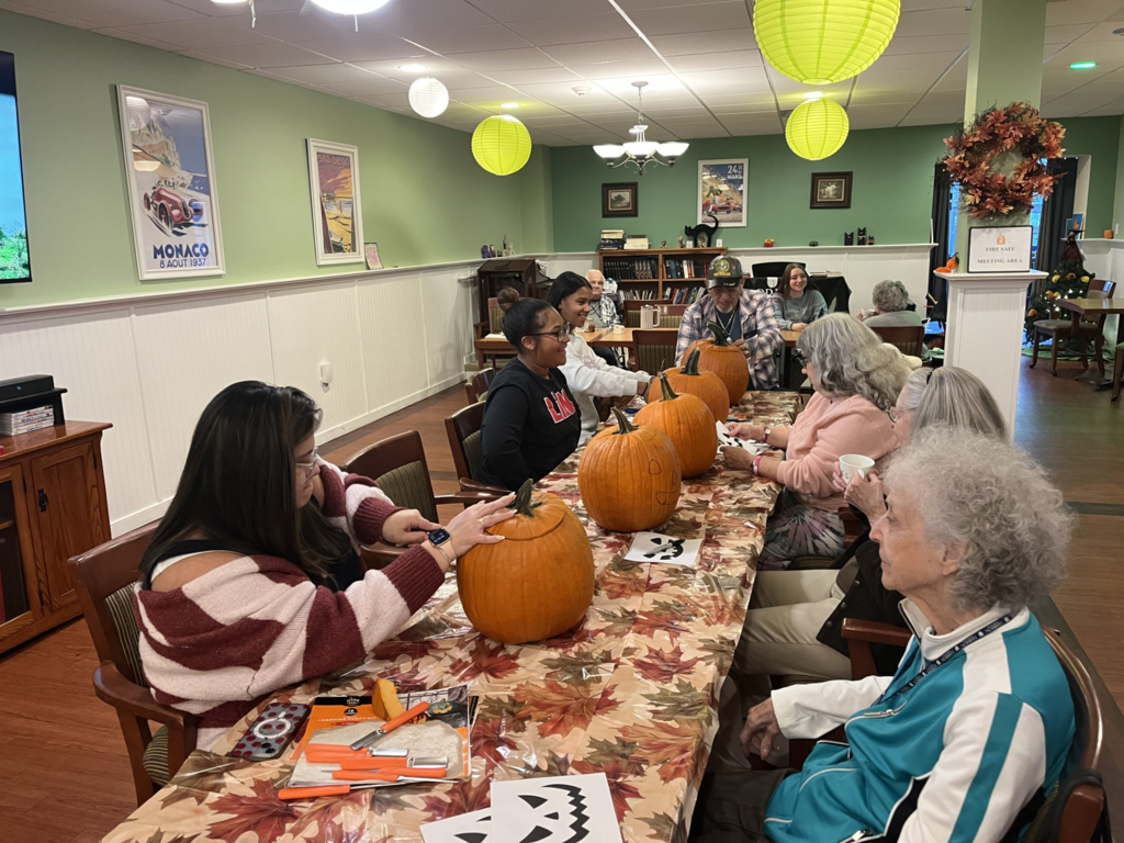 CASH Interact Club visits Harrison House on Wednesday, October 21, to visit residents and carve pumpkins pic#5