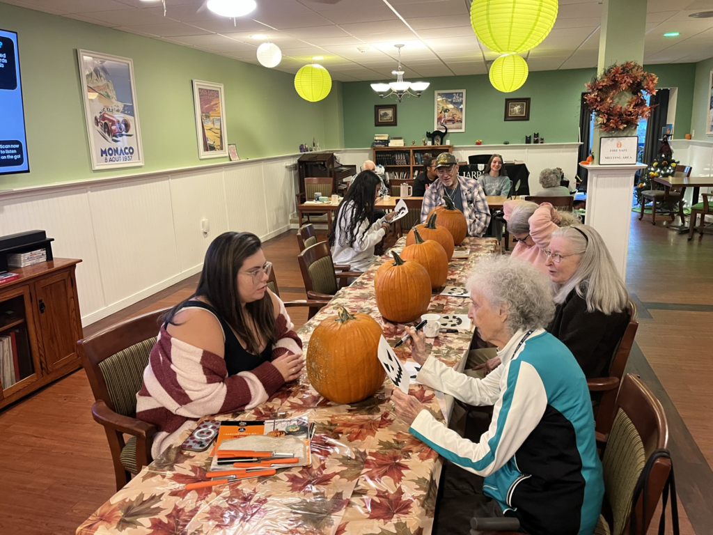 CASH Interact Club visits Harrison House on Wednesday, October 21, to visit residents and carve pumpkins pic#4