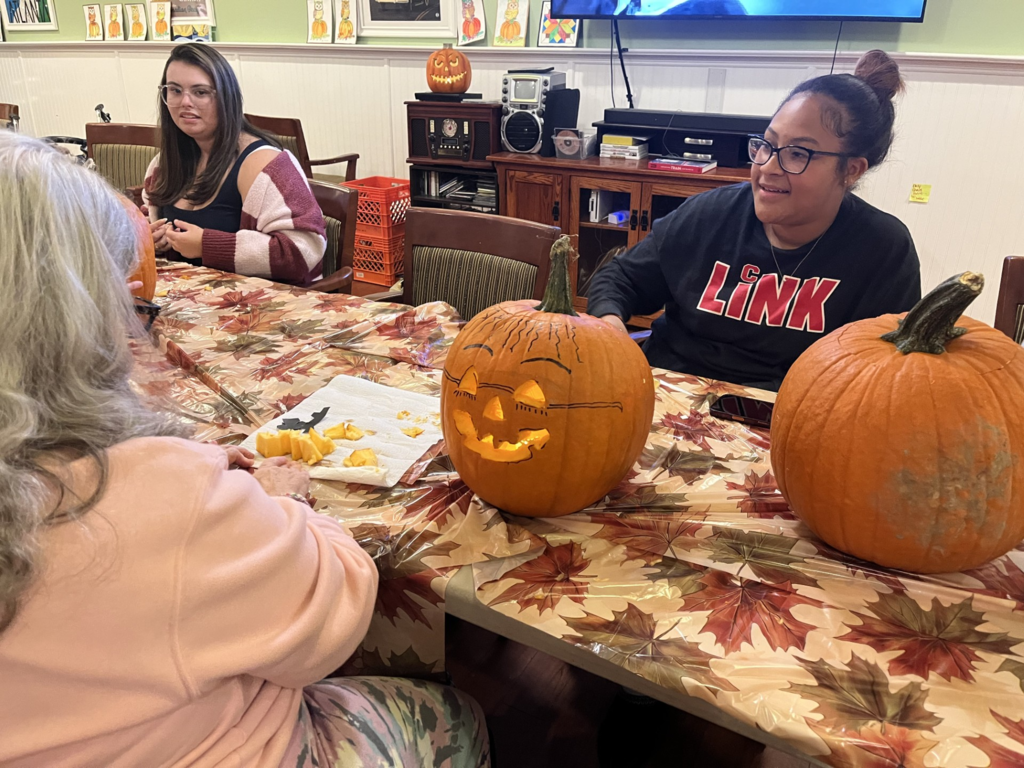 CASH Interact Club visits Harrison House on Wednesday, October 21, to visit residents and carve pumpkins pic#2