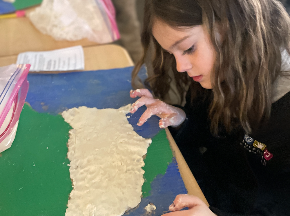 Student doing an arts & crafts project 