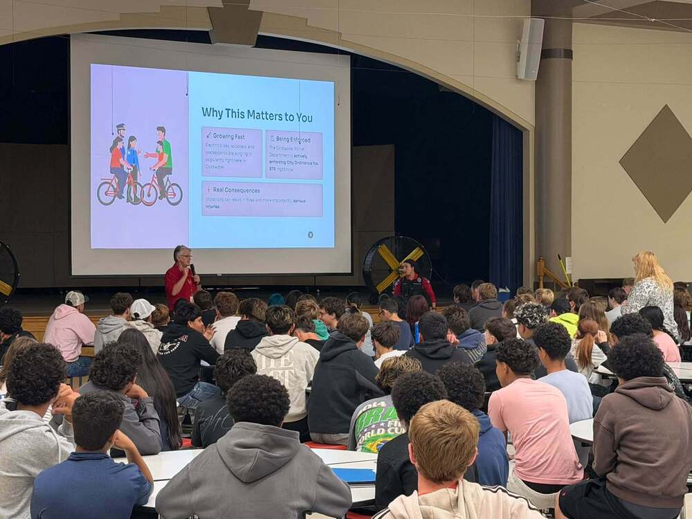 Dean of Students Robin Swartz (L) and School Resource Officer Antesar Azookari speak to CHS students.