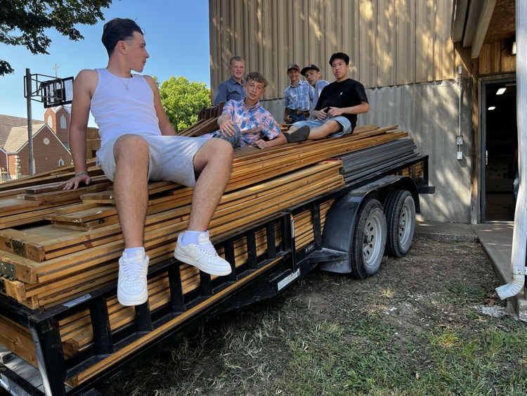 soccer boys cleaning up after Cole Camp Fair 