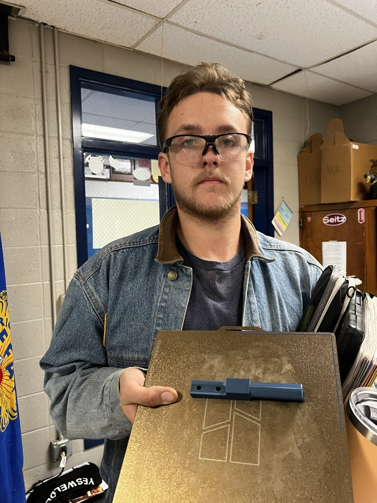 Oliver with his 3d printed fit part for testing before making it out of metal 