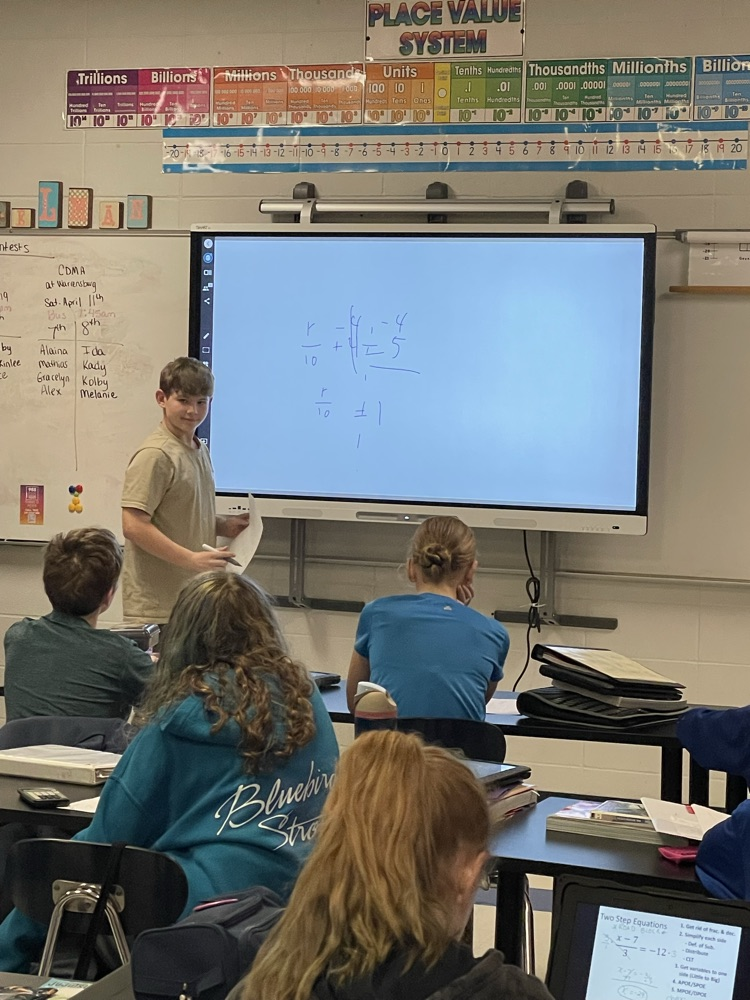 Hudson teaching the class two step equations  